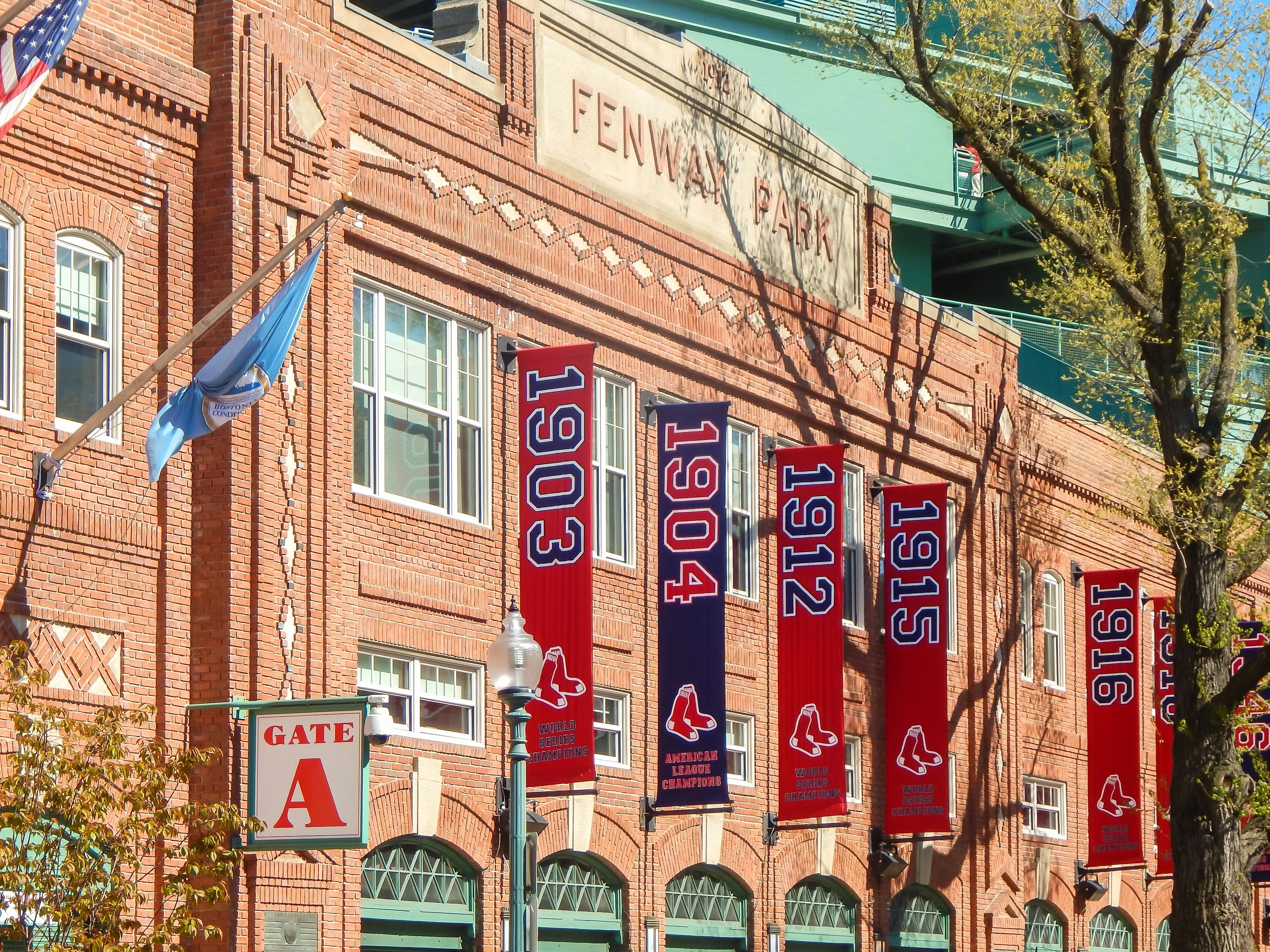 Fenway Park's entrance facade decorated with World Series championship banners